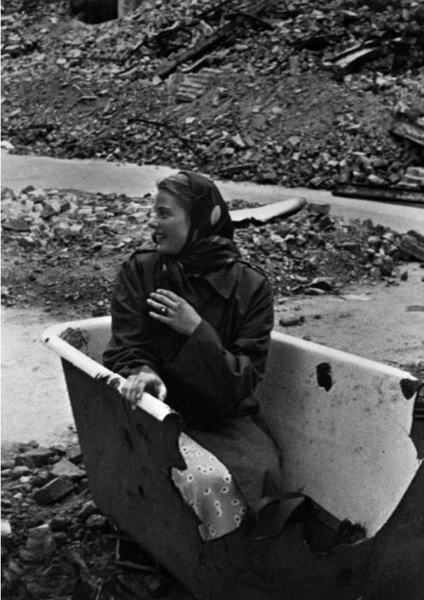 Ingrid Bergman posing for Capa in a bathtub (Berlin, 1945) by Carl Goodwin