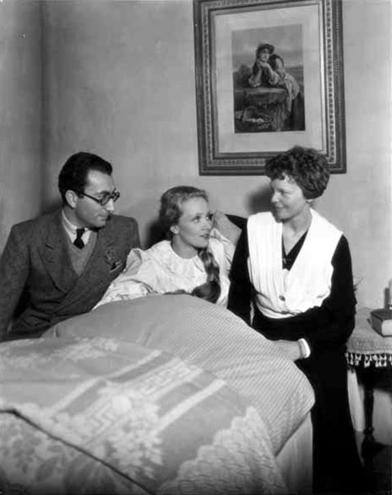Amelia Earhart (R) pays a visit to Marlene Dietrich (C) on the set of Song of Songs (1933) a film by Rouben Mamoulian (L).