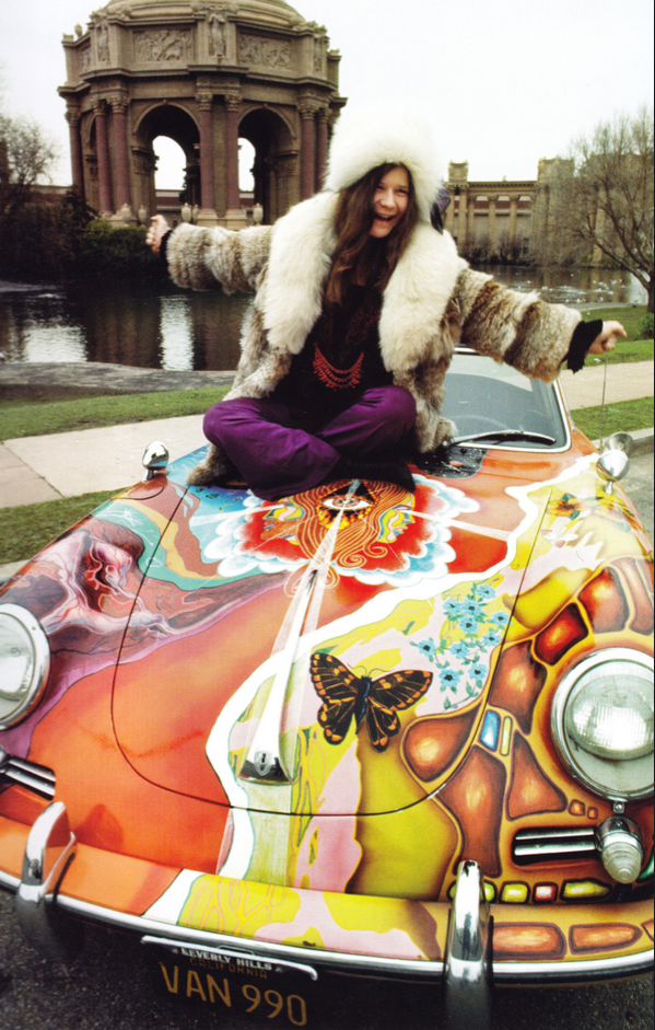 Janis Joplin sitting on her Porsche 356c with a psychedelic paint job. Photographed by Jim Marshall.